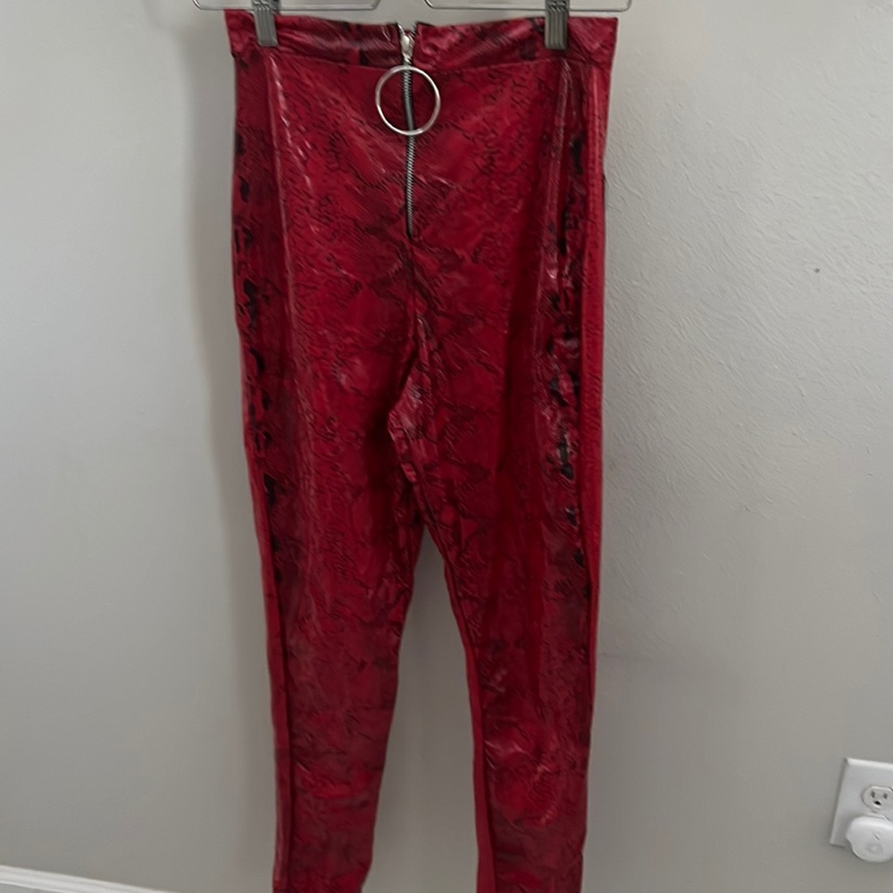 Red snake vinyl pants